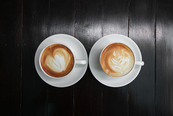 latte art coffee on wood background