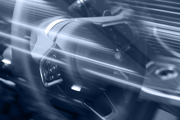 motion blurred image of car steering wheel