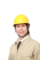 young Japanese construction worker smiles