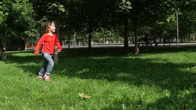 little beautiful girl outside in nature on a summer day. Slow motion