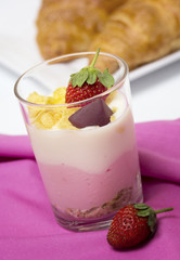 Yogurt in a glass with berries and muesli