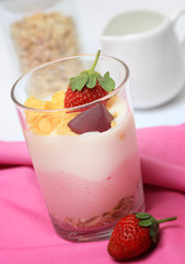 Yogurt in a glass with berries and muesli