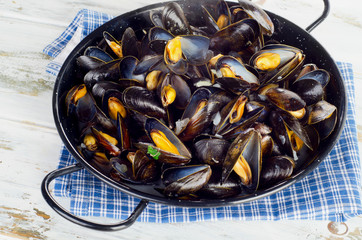 Copper pot of steamed mussels.