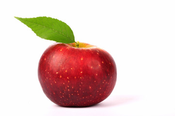 Fresh red apple with green leaf isolated on white