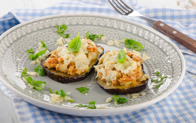 Baked eggplant with chanterelles, cheese and basil.
