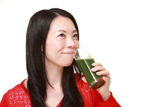 Japanese woman with green vegetable juice