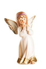 Christmas angel toy with crossed hands isolated on white backgro