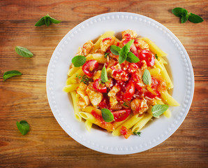 penne with meat, sauce and vegetables.