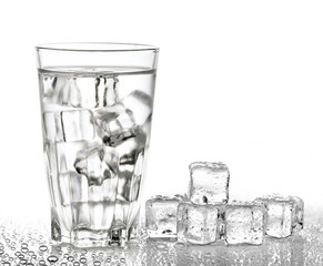 Glass of pure water with ice cubes. Isolated on white background