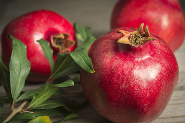 Pomegranate fruits on wooden table