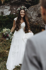beautiful fabulous happy  bride with bouquet and wreath and styl