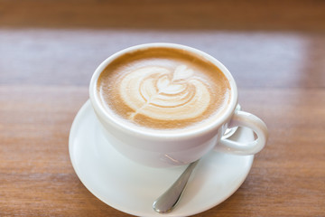 art latte coffee on white cup