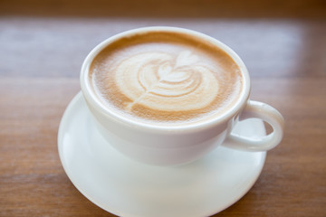art latte coffee on white cup