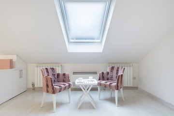 Attic converted to living space with large roof window