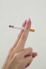 n the woman's hand cigarette