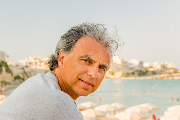 man relaxing in front of breathtaking panorama