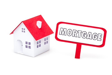Little paper house with a mortgage sign