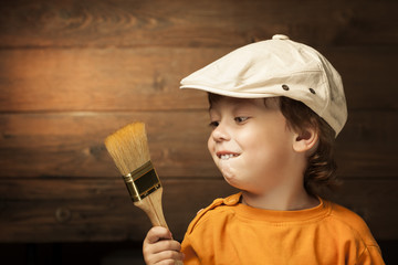 happy boy with paint brush