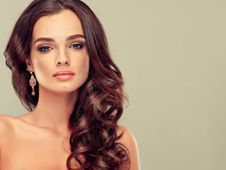 Beautiful girl light brown hair with an elegant hairstyle , hair wave ,curly hairstyle 

