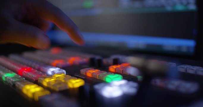 Hand Pulling The T-Bar On A Video Switcher