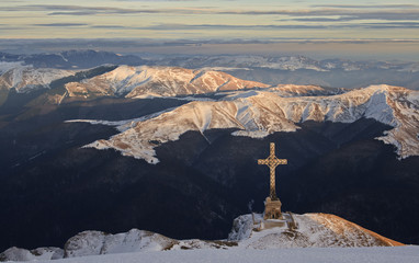 Big cross over the valley in winter