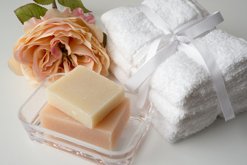 soaps, towels and rose
