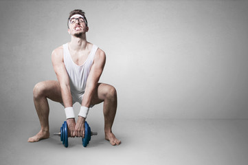 young nerd try to lift weights