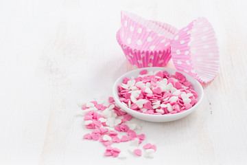 colored sugar hearts and paper baking dishes