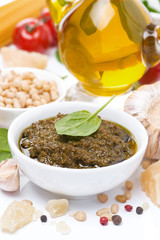 Italian pesto sauce, pasta and ingredients, vertical