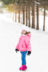 Portrait of funny child in winter park