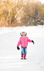 Portrait of funny child in winter park