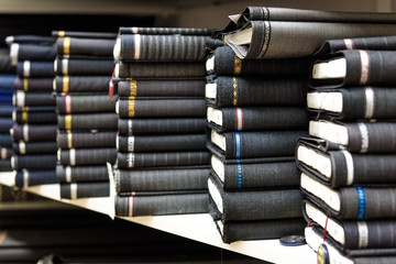 Rolls of fabric and textiles in a factory shop or  store