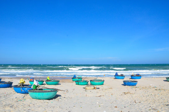 Round boats on beach