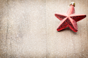 Christmas decoration with fir branches on the wood background.