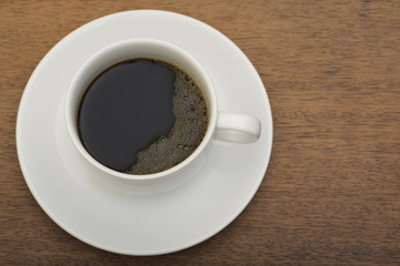 Coffee cup on the wooden