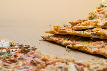 Delicious salmon pizza in a cardboard box