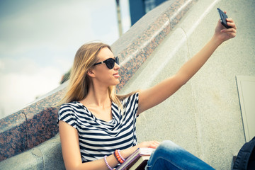 Fototapeta premium Girl making selfie