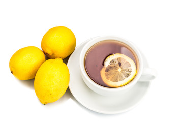 Refreshing hot tea with lemon slice on white background