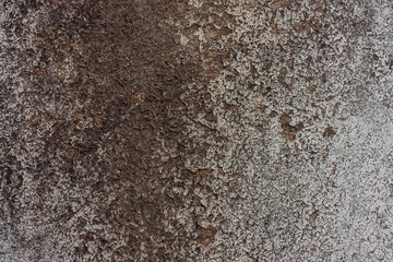 Textured walls with dirt.