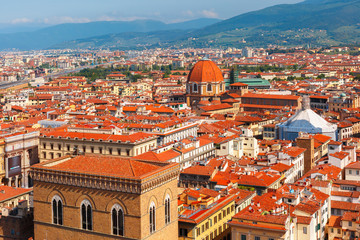 Fototapeta na wymiar City rooftops and Medici Chapel in Florence, Italy