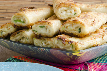 Fried rolls of pita with cheese