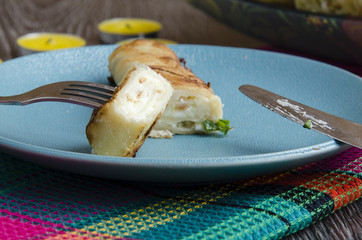 Fried rolls of pita with cheese