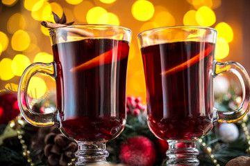 Christmas hot mulled wine with spices on a wooden table. The idea for creating greeting cards