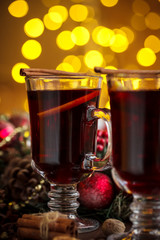 Christmas hot mulled wine with spices on a wooden table. The idea for creating greeting cards