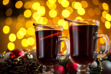 Christmas hot mulled wine with spices on a wooden table. The idea for creating greeting cards