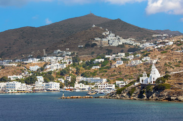 Chora - The church Agia Irini on the right side and Chora town on the Ios island in the Aegean Sea (Greece).