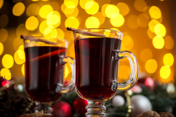 Christmas hot mulled wine with spices on a wooden table. The idea for creating greeting cards