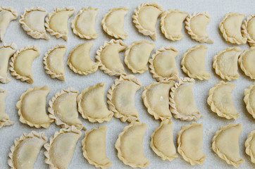 Cheese ravioli lie on the kitchen table