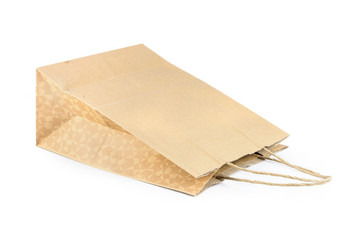 Brown kraft paper bag. It is isolated on white background.