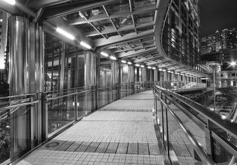 Empty pedestrian walkway in midtown at night
